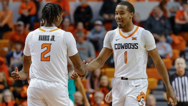 Dec 20, 2022; Stillwater, Oklahoma, USA; Oklahoma State Cowboys guard Bryce Thompson (1) and guard Chris Harris Jr. (2) celebrate after a play against the Texas A&M-Corpus Christi Islanders during the second half at Gallagher-Iba Arena. Oklahoma State won 81-58.